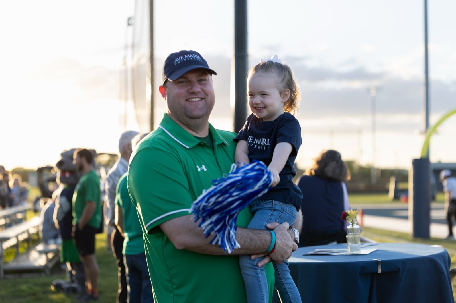 Alumni and families gathered at the Booster Club hospitality tent before kickoff
