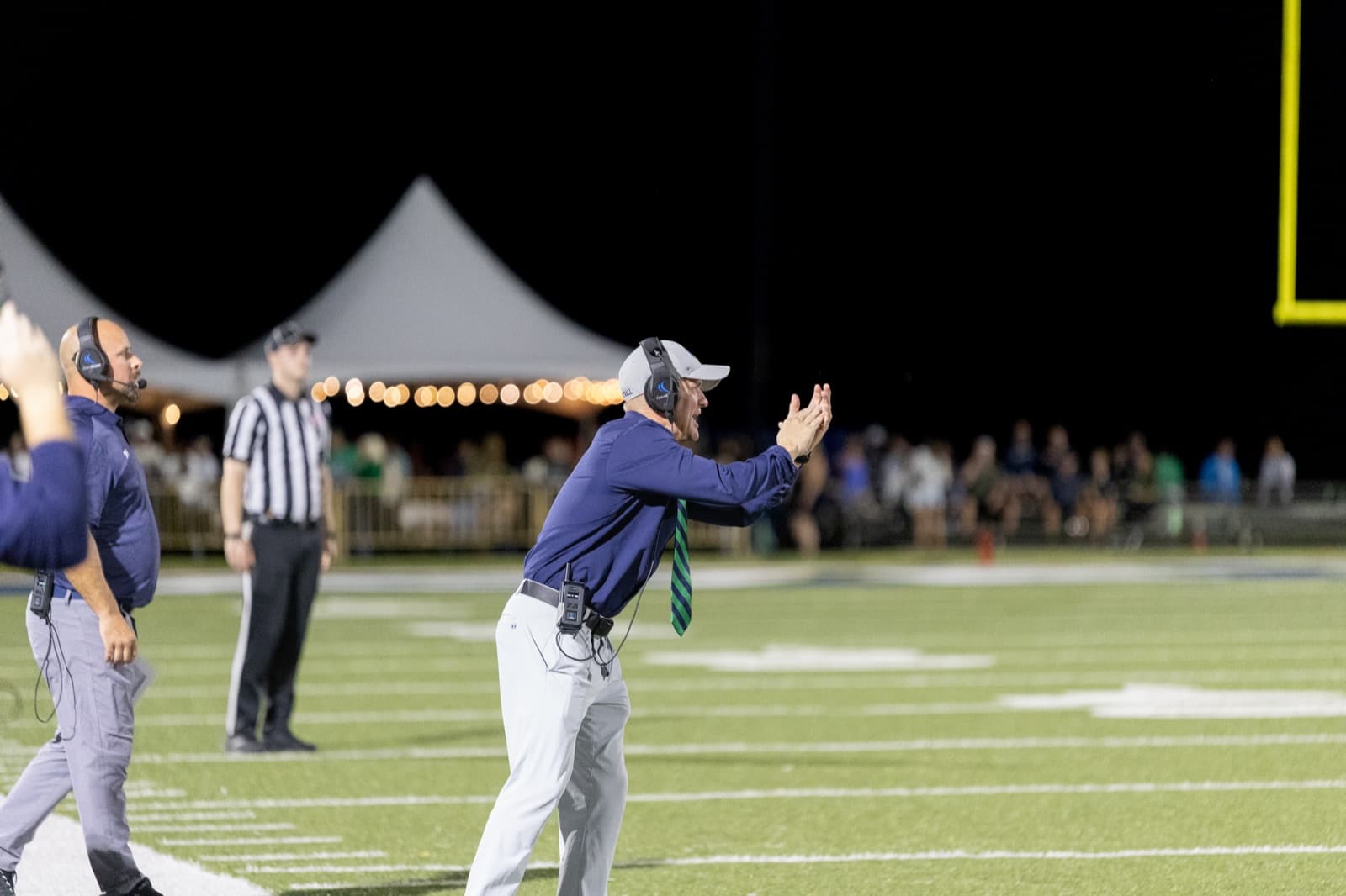 Homecoming crowd cheering on Ave Maria football from the stands