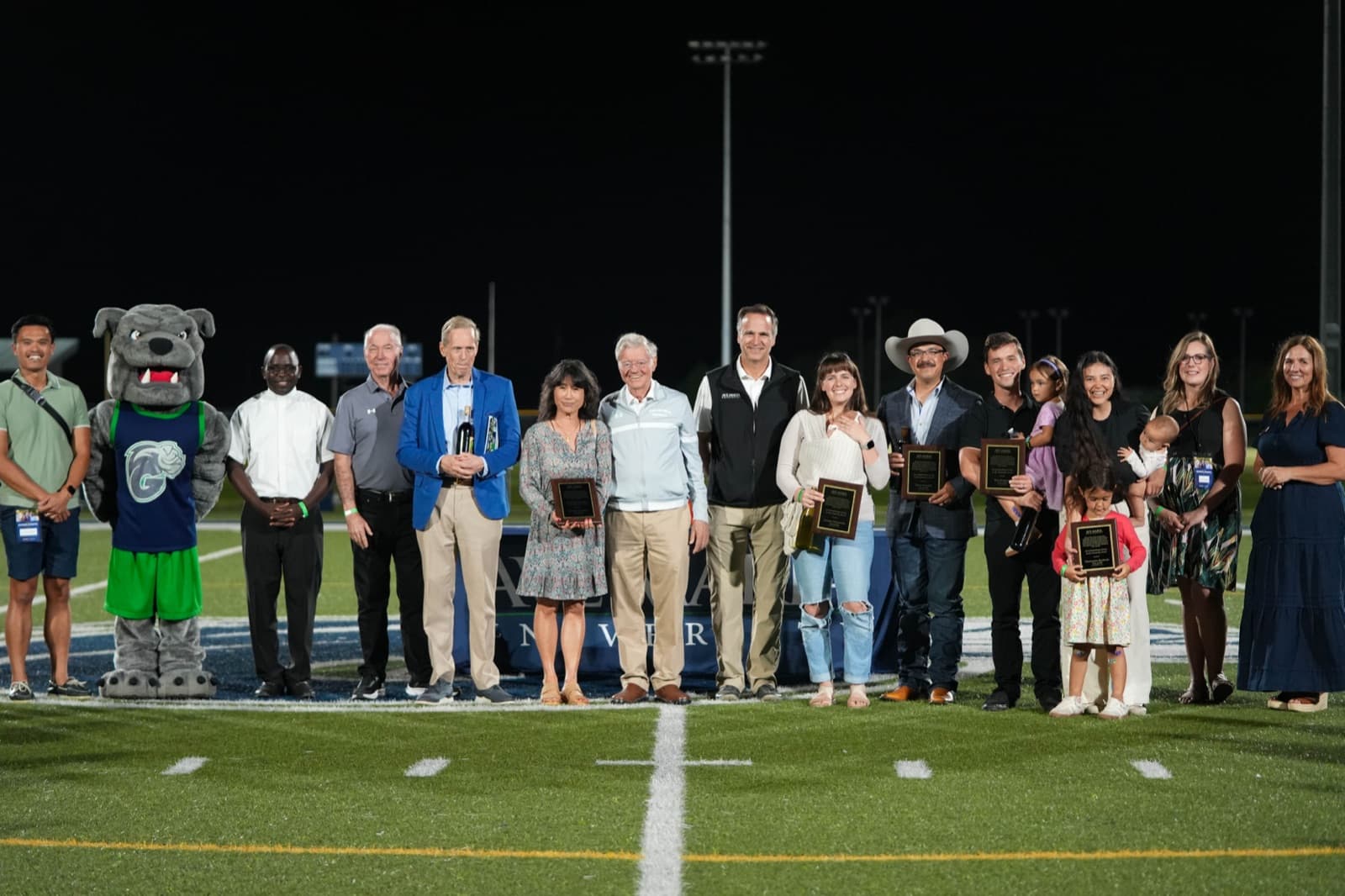 Commemorative photo with an Alumni Award recipient during Homecoming