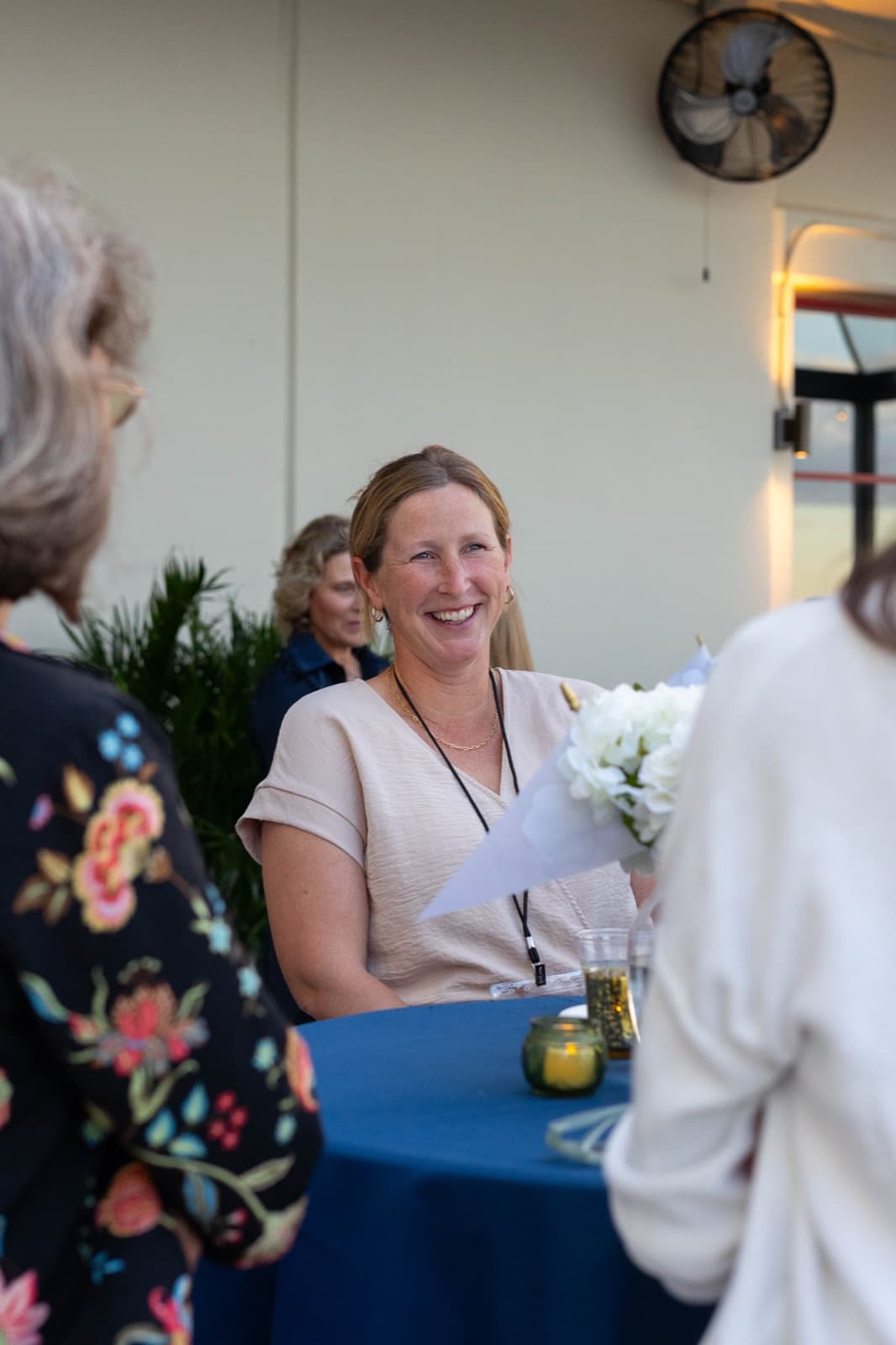 Alumni and university leaders talking at the Homecoming reception