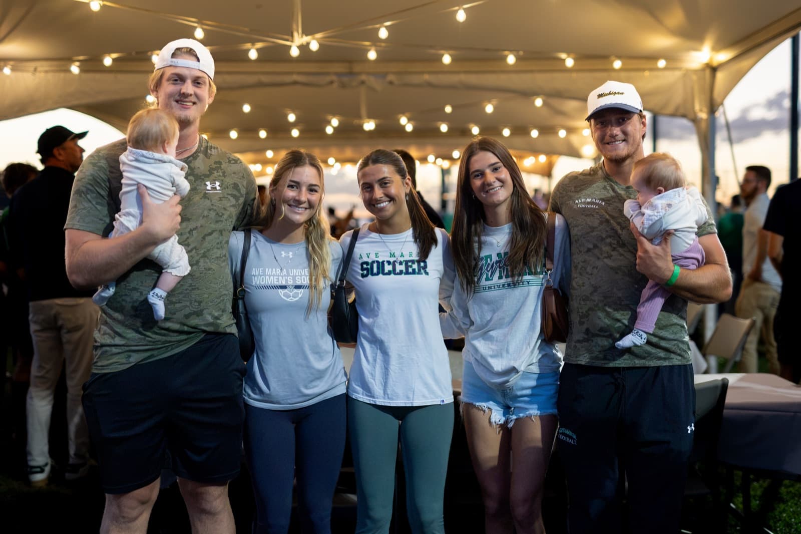 Alumni reconnecting on the sidelines during the Homecoming football game