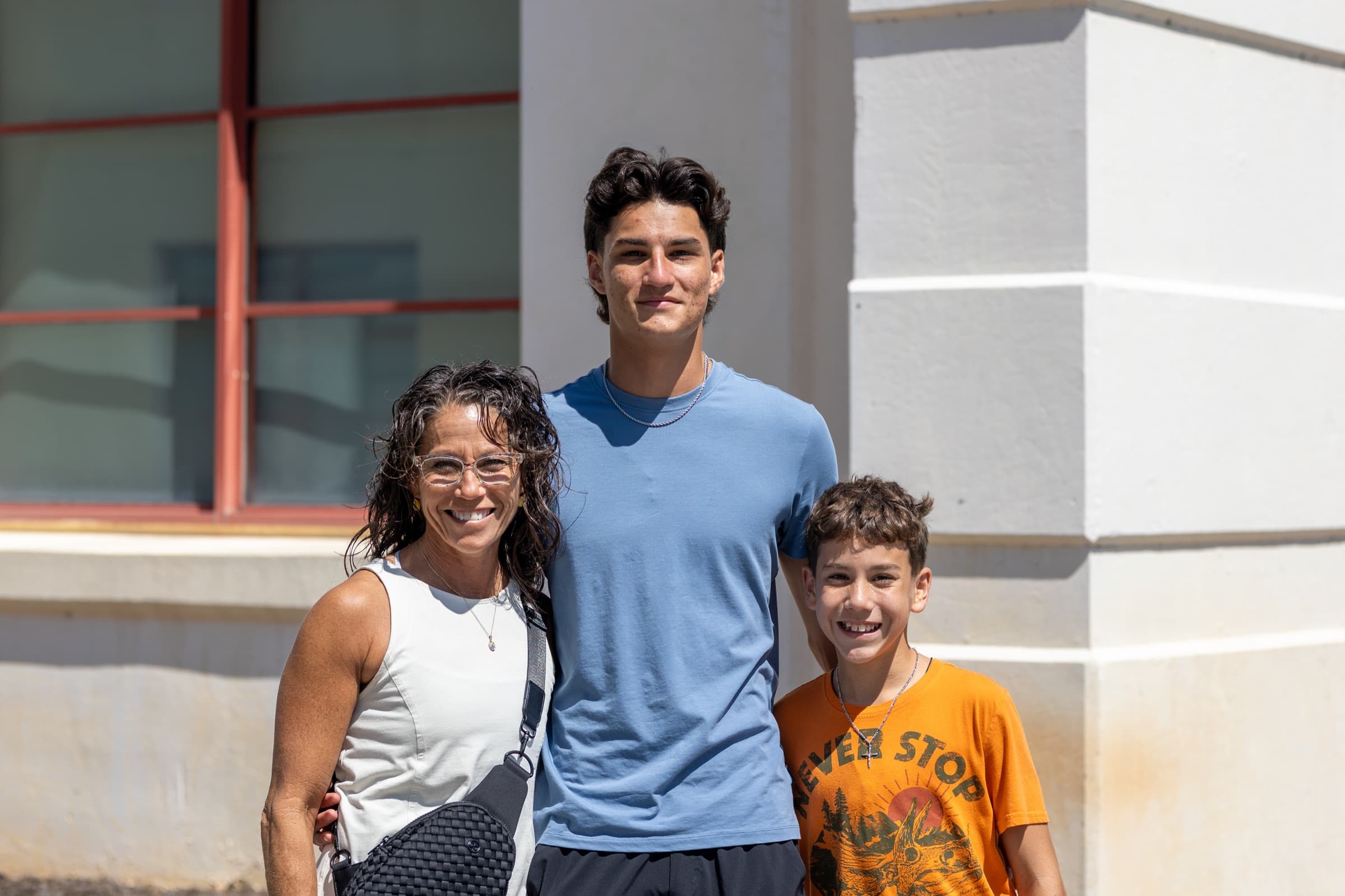 A mother with her sons on campus