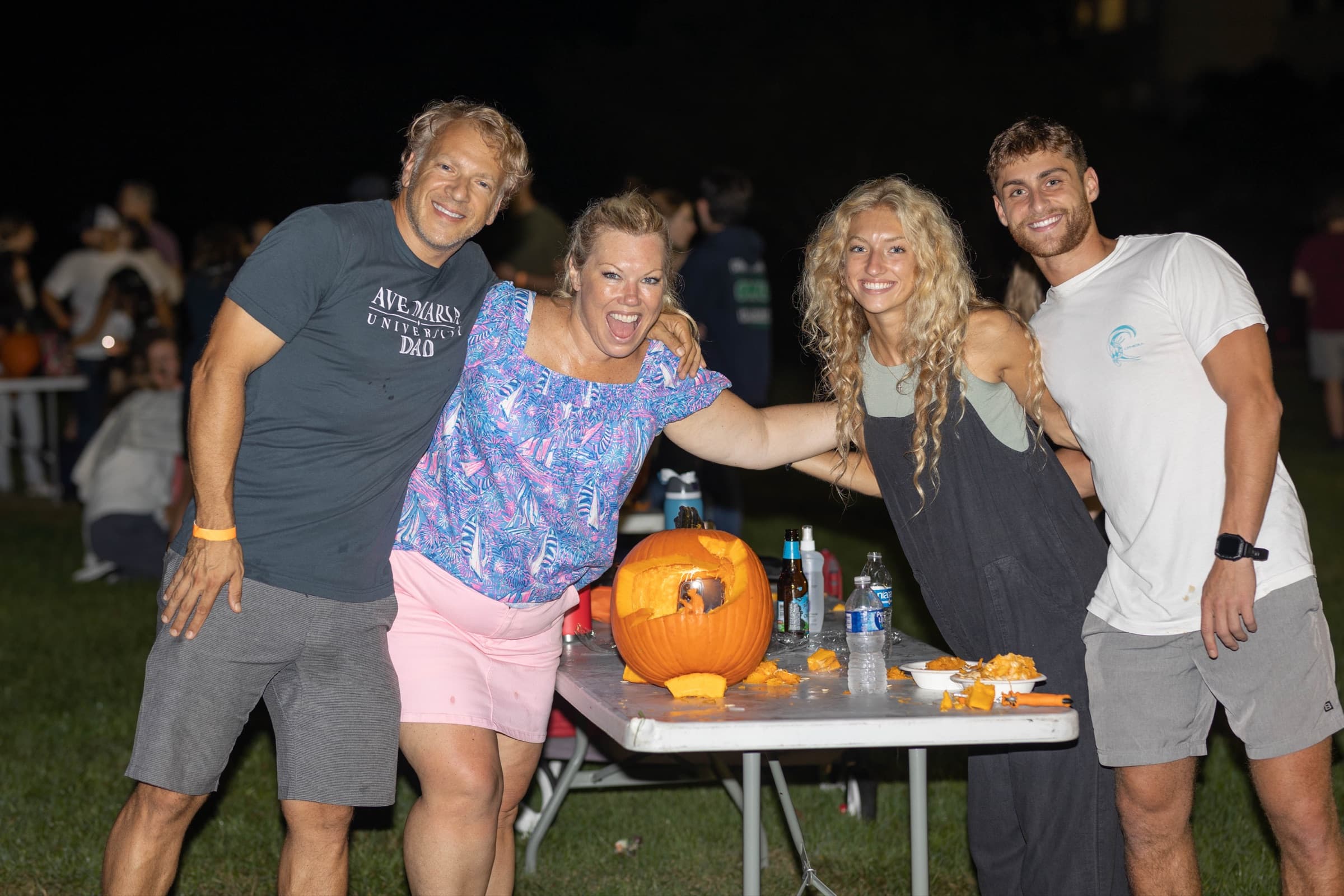 Families carving pumpkins at the Bilbo Baggins Birthday Party