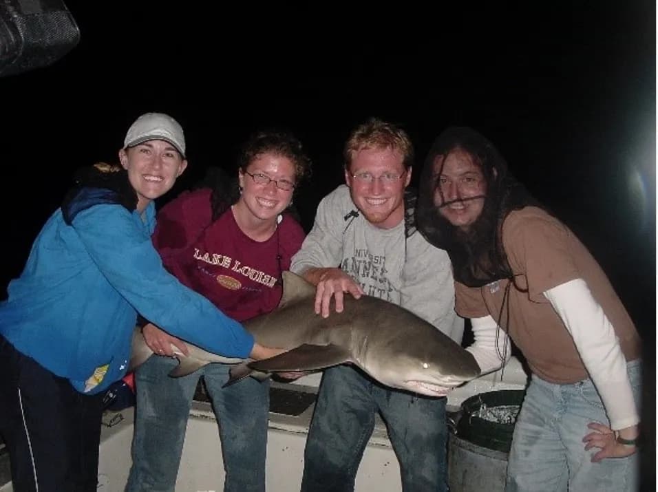Anthony Jay with his wife, Allison, and other members of the Shark Fishing Club at AMU (which Jay himself founded).