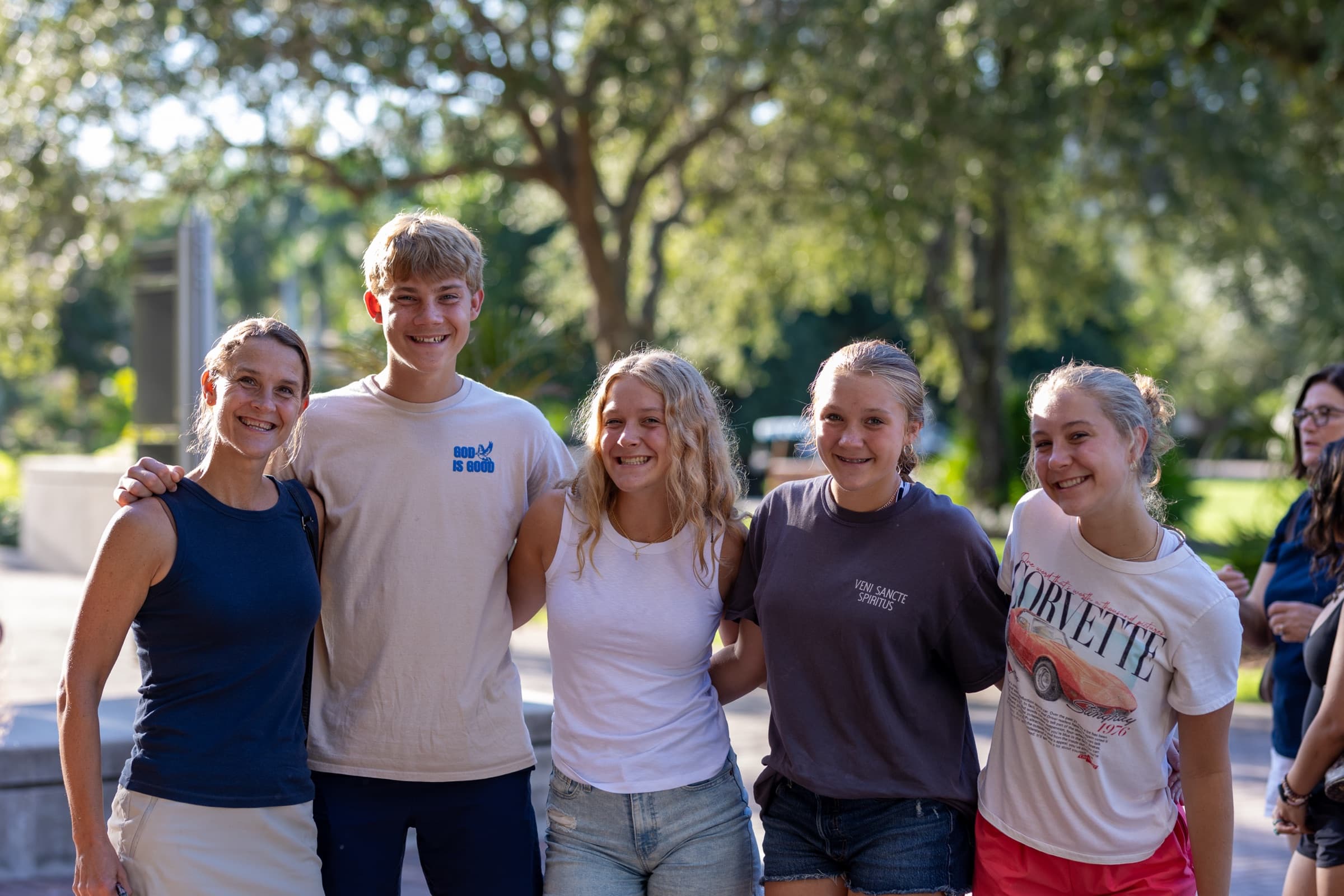 A mother and her college students together on campus